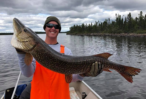 Guy with Pike at Misaw Lake Lodge